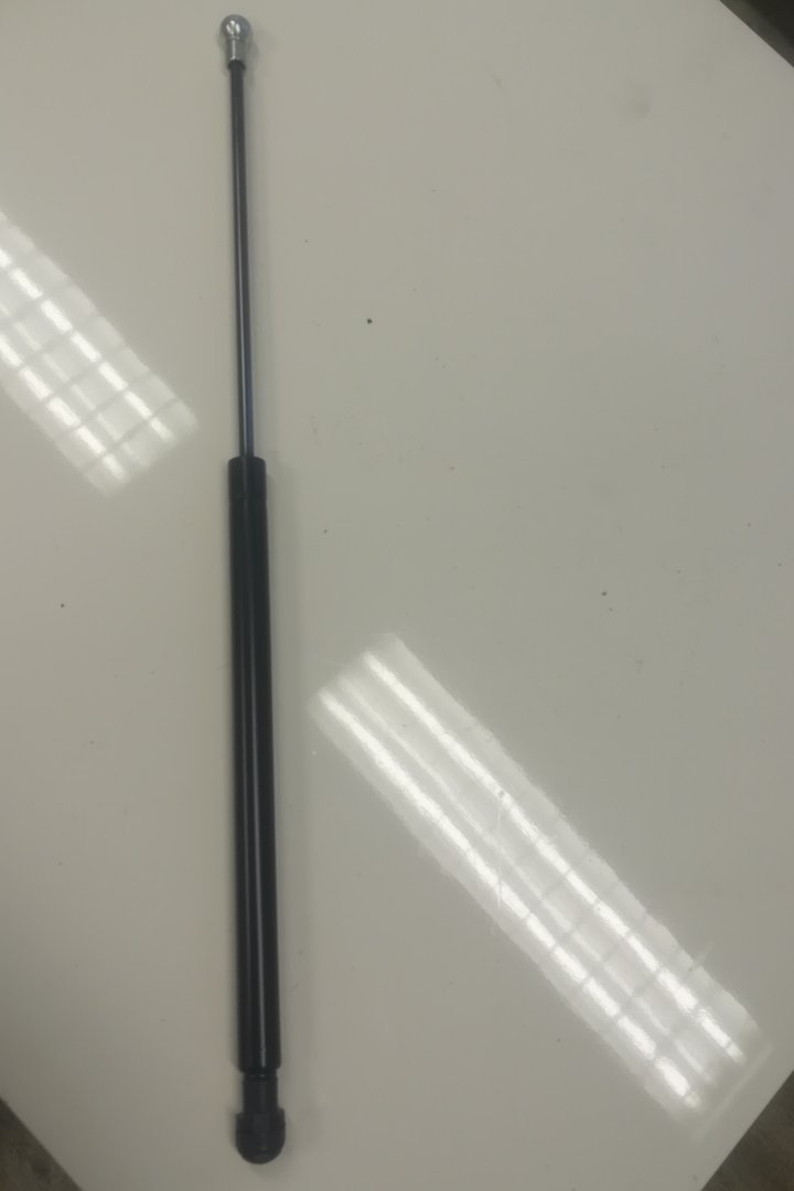 Gas spring storage compartment